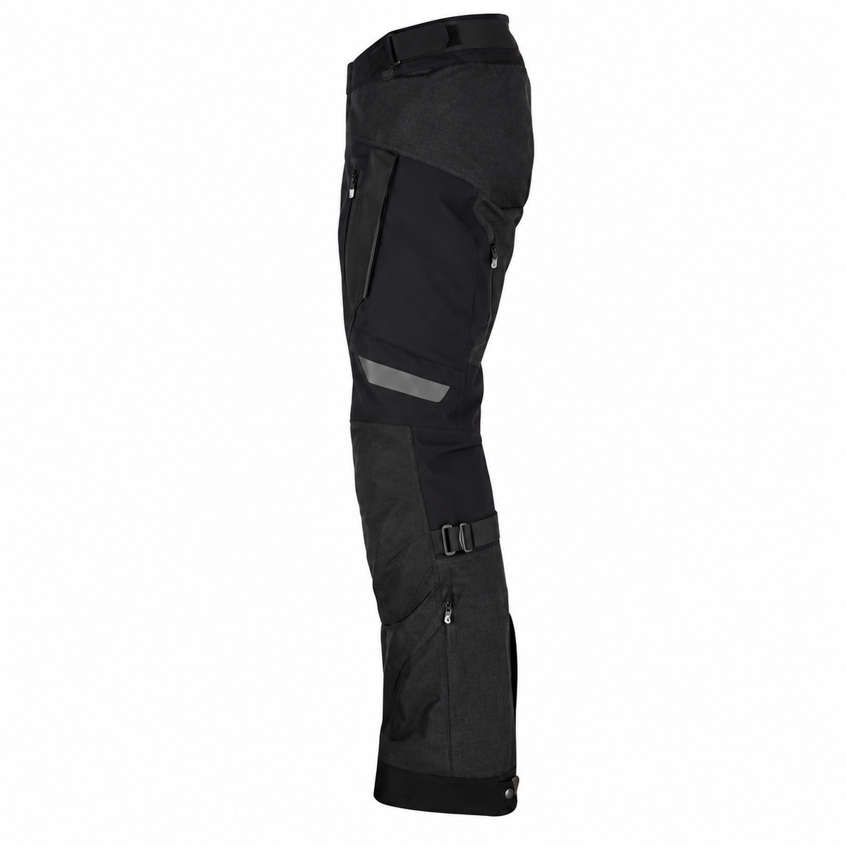 Side view of black KLIM adventure motorcycle riding pants featuring reinforced knee panels, zippered pockets, adjustable leg straps, and durable riding gear construction.
